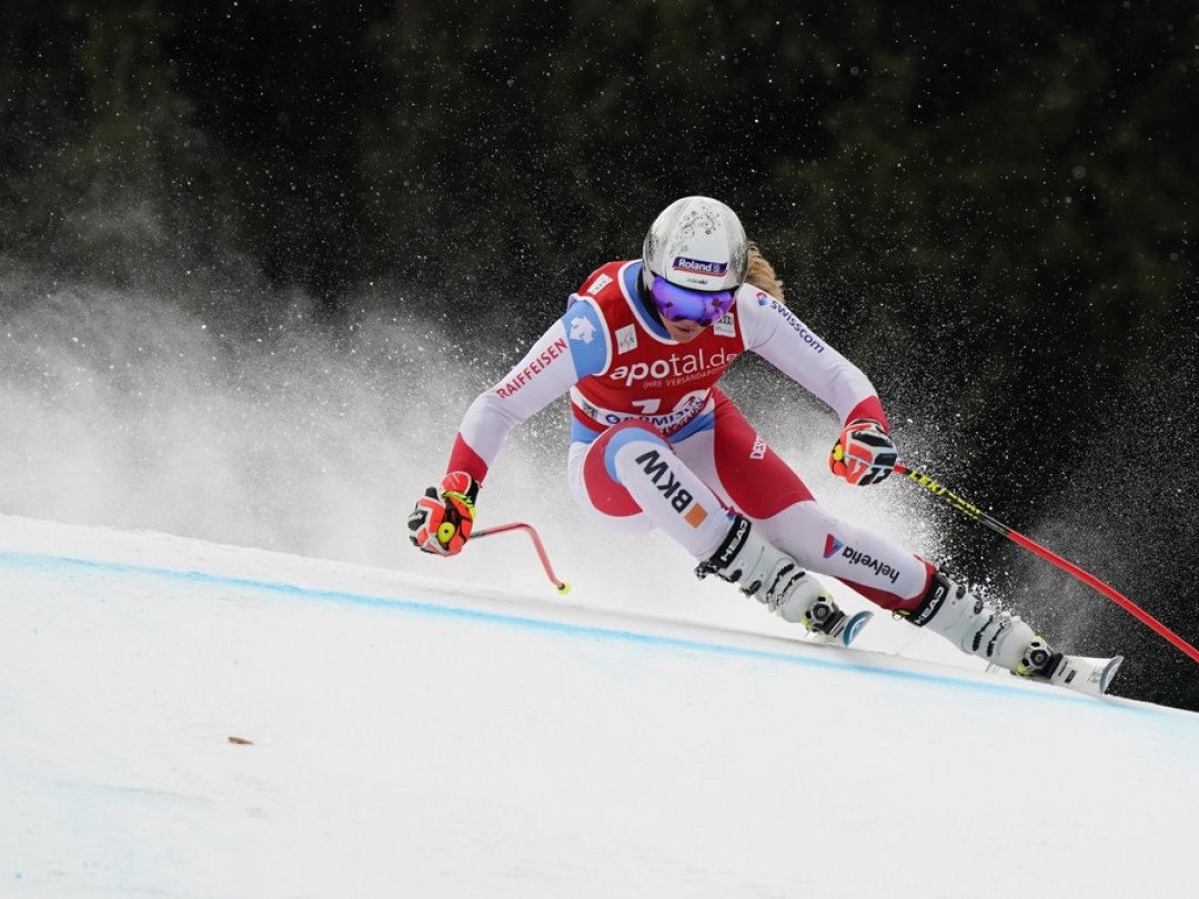 Switzerland's Corinne Suter competes during an alpine ski, women's World Cup downhill training session in Garmish Partenkirchen, Germany, Friday, Jan. 28, 2022. (AP Photo/Marco Tacca)