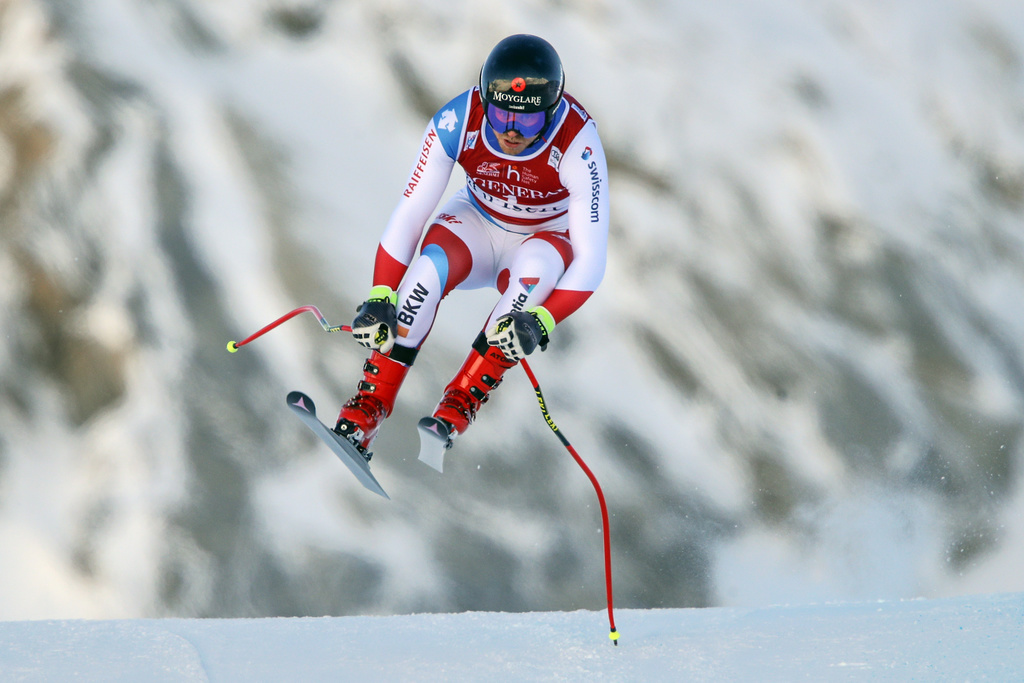 Switzerland's Mauro Caviezel speeds down the course during an alpine ski, men's World Cup downhill, in Val d'Isere, France, Sunday, Dec. 13, 2020. (AP Photo/Gabriele Facciotti)