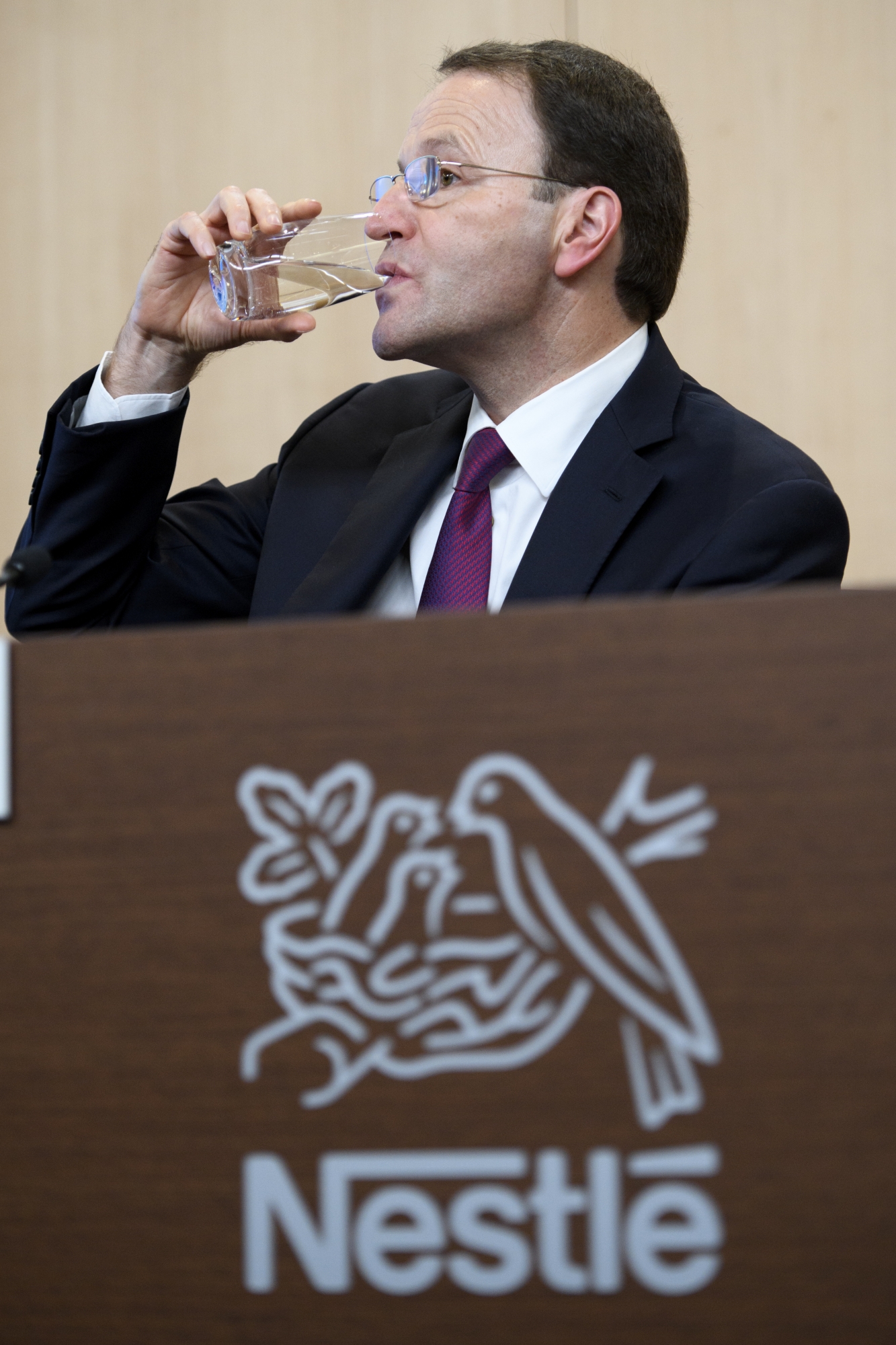 Nestle's new CEO Ulf Mark Schneider drinks a glas of water during the 2016 full-year results press conference of the food and drinks giant Nestle in Vevey, Switzerland, Thursday, February 16, 2017. Nestle SA, the world's biggest food and drinks producer, fiscal 2016 profit declined to 8.53 billion Swiss francs for 2016. (KEYSTONE/Laurent Gillieron)
