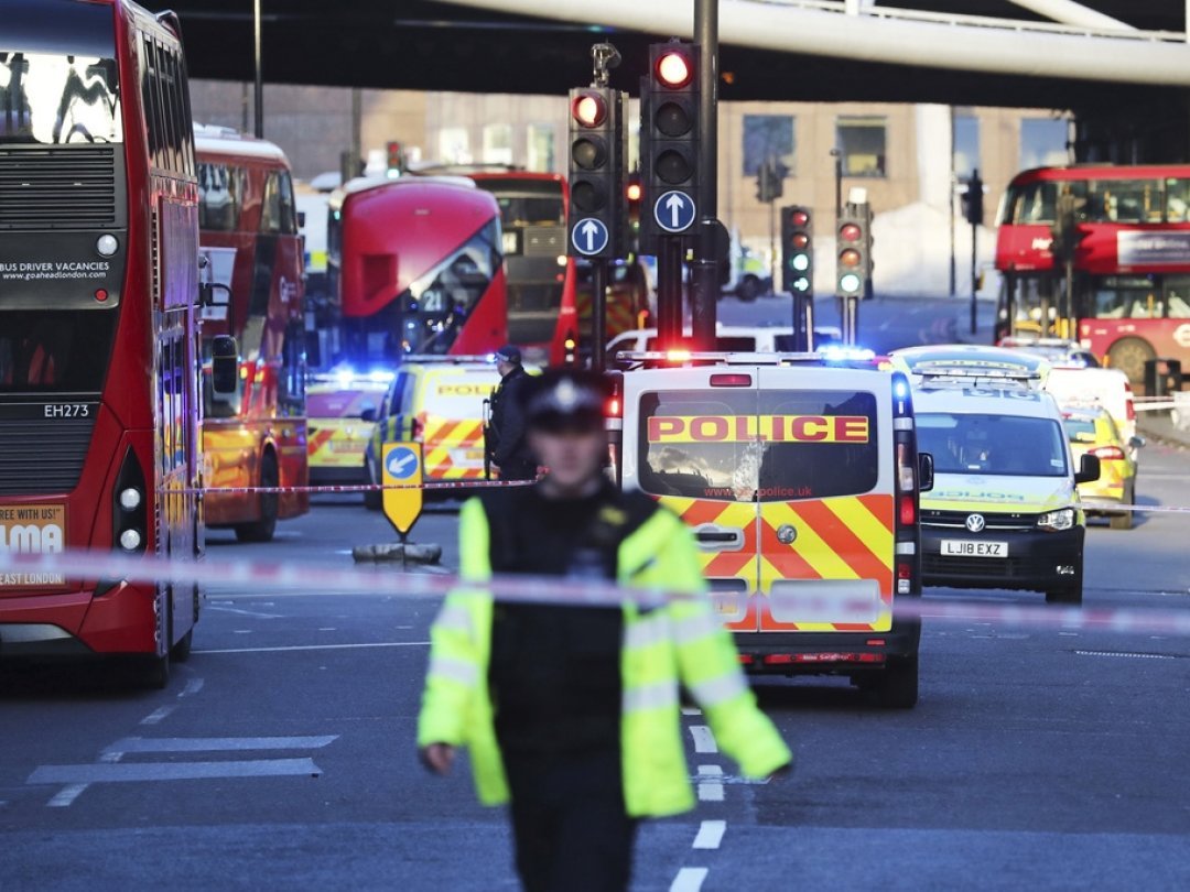 Police and emergency services at the scene of an incident on London Bridge in central London following a police incident, Friday, Nov. 29, 2019. British police said Friday they were dealing with an incident on London Bridge, and witnesses have reported hearing gunshots. The Metropolitan Police force tweeted that officers were âÄ&#x153;in the early stages of dealing with an incident at London Bridge.âÄ (Gareth Fuller/PA via AP)