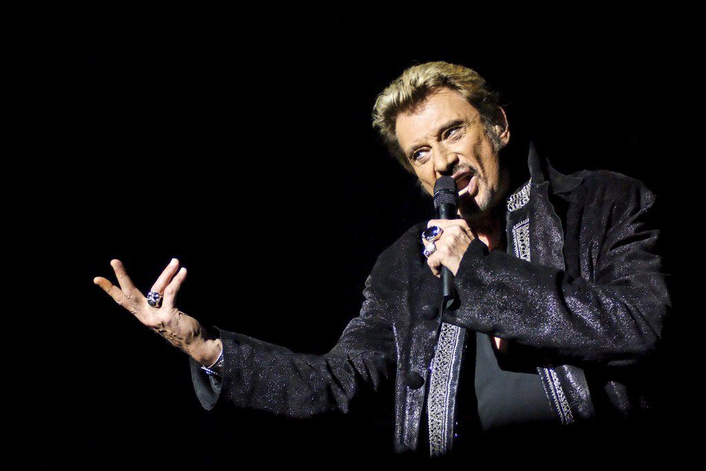 epa03371144 (FILE) A file picture dated 27 October 2006 shows French singer Johnny Hallyday performing on stage during a concert in Brussels, Belgium. Media reports on 27 August 2012 state Johnny Hallyday has been admitted to hospital in Point-a-Pitre, Guadeloupe Island, after suffering from tachycardia late 25 August 2012.  EPA/ERIC BOMAL BELGIUM OUT