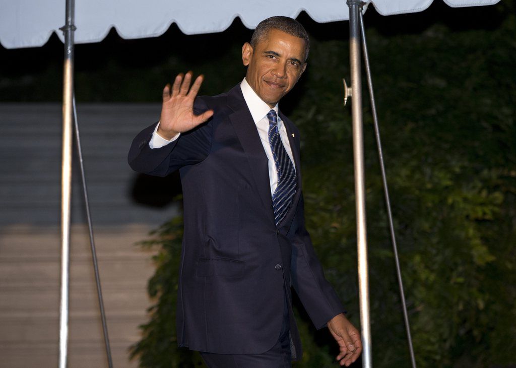 President Barack waves as he walks to board Marine One on the South Lawn of the White House on Tuesday, Sept. 3, 2013 in Washington. Deep uncertainty surrounding military action against Syria hangs over Obama's three-day overseas trip to Sweden and Russia, which takes him away from Washington just as he's seeking support on Capitol Hill for a strike. (AP Photo/Evan Vucci)