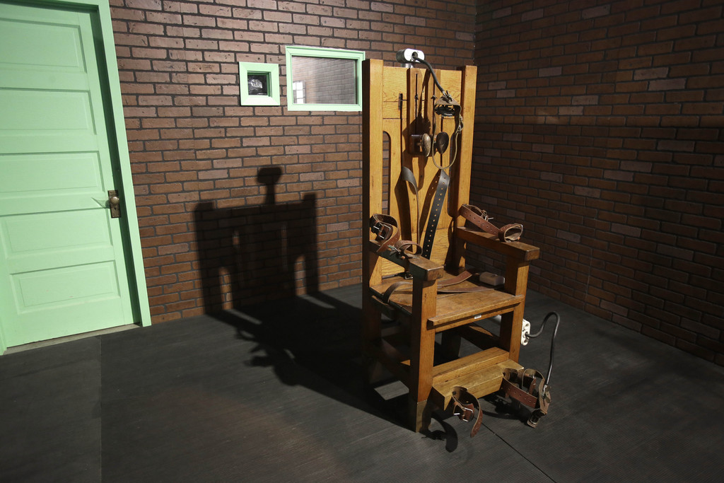 This photo taken May 16, 2013, shows an electric chair on exhibit at the Texas Prison Museum in Huntsville, Texas. Between 1924 and 1964, 361 men died in the electric chair. Since the first execution by lethal injection in Texas in 1982 the state has executed 499 prisoners.  (AP Photo/Pat Sullivan)