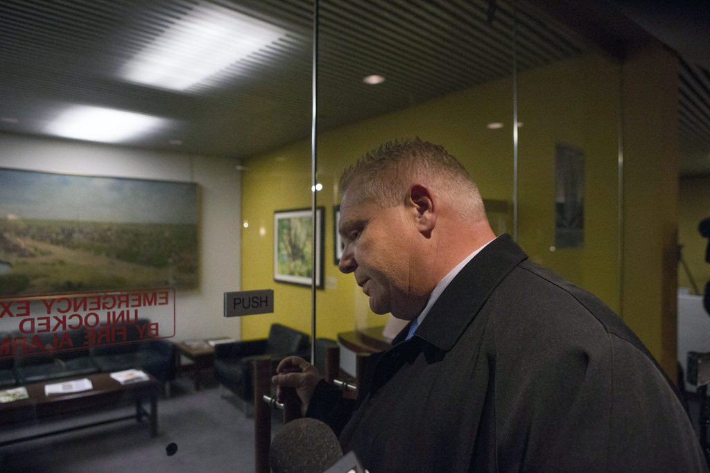 Toronto City Councillor Doug Ford enters his brother Mayor Rob Ford's office in Toronto on Wednesday, Nov. 13, 2013. Rob Ford admitted Wednesday that he bought illegal drugs in the past two years and that he will not step down. (AP Photo/The Canadian Press, Chris Young)