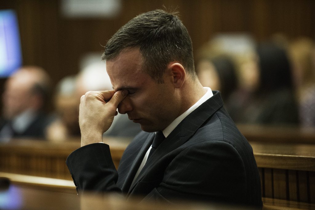 epa04168665 South African Olympic and Paralympic sprinter Oscar Pistorius is seen during his trial at the high court in Pretoria, South Africa, 16 April 2014. Pistorius is accused of the murder of his model girlfriend Reeva Steenkamp in February 2013.  EPA/GIANLUIGI GUERCIA / POOL