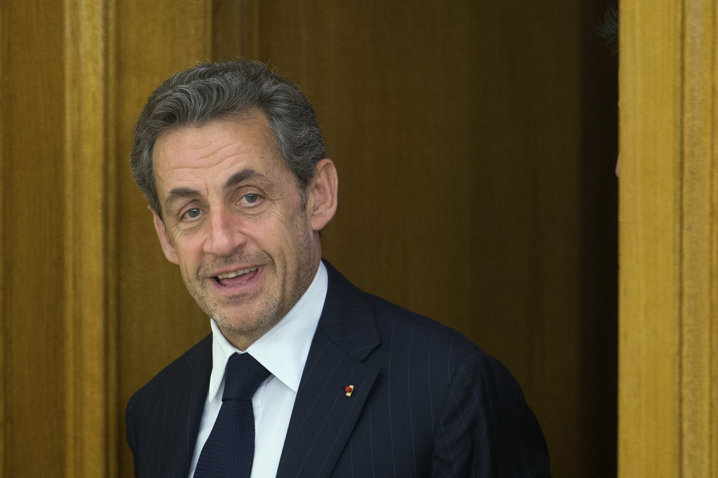 Former French President Nicolas Sarkozy enters a room to meet with Spain's King Juan Carlos at the Zarzuela Palace in Madrid, Spain, Tuesday, May 27, 2014. Sarkozy earlier met with Spain's Premier Mariano Rajoy. (AP Photo/Paul White)