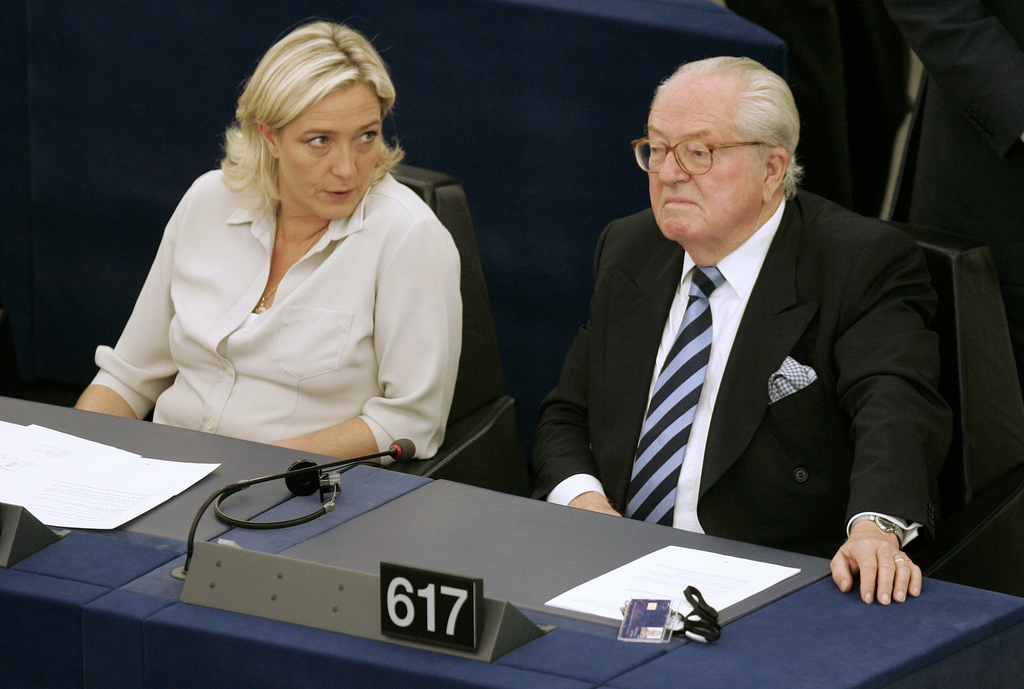 FILE - In this July 14, 2009 file photo Jean-Marie Le Pen, right, and his daughter Marine Le Pen sit at the European Parliament, in Strasbourg, eastern France. A Greek tragedy is playing out in the House of Le Pen, the seat of France's rising far right, with the wounded patriarch lashing out at his daughter, his political heir, in a feud over an anti-Semitic smear that goes to the heart of her efforts to broaden the party's support. (AP Photo/Lionel Cironneau, File)