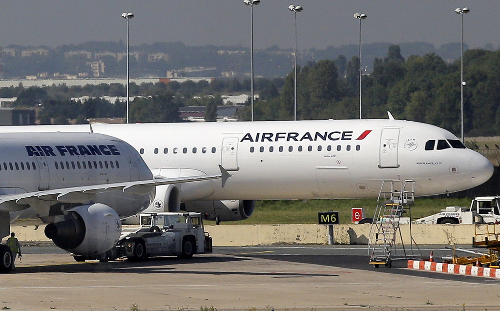 Air France planes are parked on the tarmac at Paris Orly airport, near Paris, Monday, Sept. 15, 2014. Pilots for Air France have kicked off a weeklong strike, angry that the airline is shifting jobs and operations to a low-cost carrier to better keep up with competition. (AP Photo/Christophe Ena)