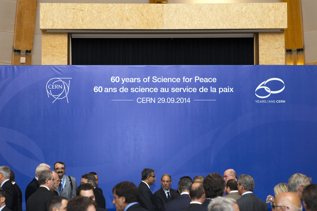 Delegates speak together before the official CERN's 60th anniversary ceremony, Monday, September 29, 2014, in Geneva, Switzerland. CERN, the European Organization for Nuclear Research, was born in 1954 from the vision of a small number of scientists who saw the opportunity not only to build a world-class laboratory for nuclear and particle physics in Europe, but also to bring nations together through science. (KEYSTONE/Salvatore di Nolfi)