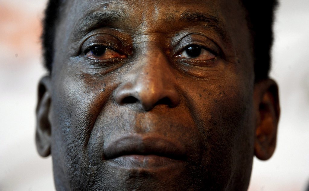 In this Wednesday, April 2, 2014 photo, Edson Arantes do Nascimento, better known as Pele, is interviewed at The Associated Press in New York. In a little more than two months, the World Cup will be played in Brazil for the first time since 1950, when 9-year-old Edson's father listened on the radio as Brazil lost the final round-robin game and the title 2-1 to Uruguay in Rio de Janeiro.  (AP Photo/Mark Lennihan)