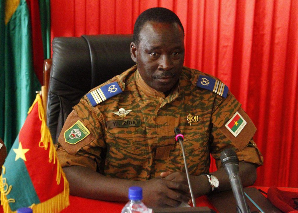 epa04474752 Transitional leader of Burkina Faso Lieutenat-Colonel Isaac Zida during a meeting with members of the diplomatic corps in Ouagadougou, Burkina Faso, 03 November 2014. President Blaise Compaore on 31 October 2014 resigned following the violent protests against his bid to change the constitution to extend his rule of 27 years. After a brief claim to power by army General Honore Traore a power struggle ensued with Presidential guard commander Lieutenat-Colonel Isaac Zida being appointed as transitional leader. Thousands of protestors took to the Place de la Nation 02 November in protest against the military rule.  EPA/LEGNAN KOULA