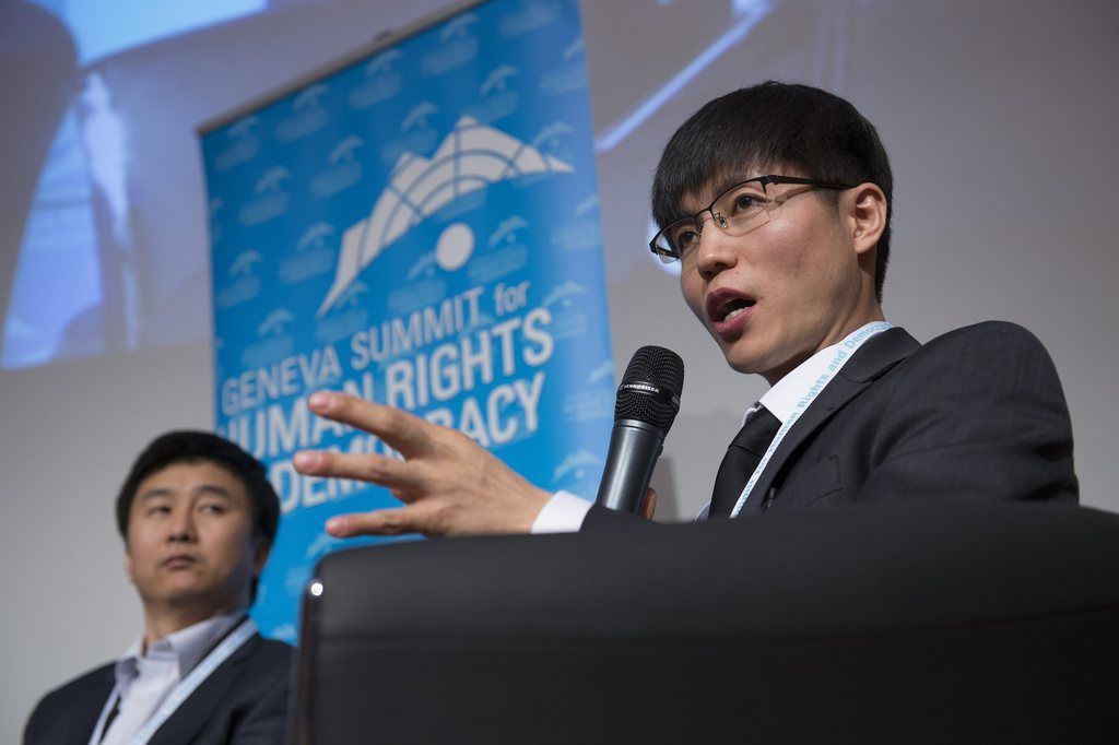 Kang Chol-Hwan, North Korean defector, left, and Shin Dong-Hyuk, North Korean defector, right, speaks during a panel "Crimes Against Humanity: Slavery, Genocide and Concentration Camps - In Our Own Time?" at the fifth Geneva Summit for Human Rights and Democracy at the International Conference Center in Geneva (CICG), in Geneva, Switzerland, Tuesday, February 19, 2013. (KEYSTONE/Jean-Christophe Bott)