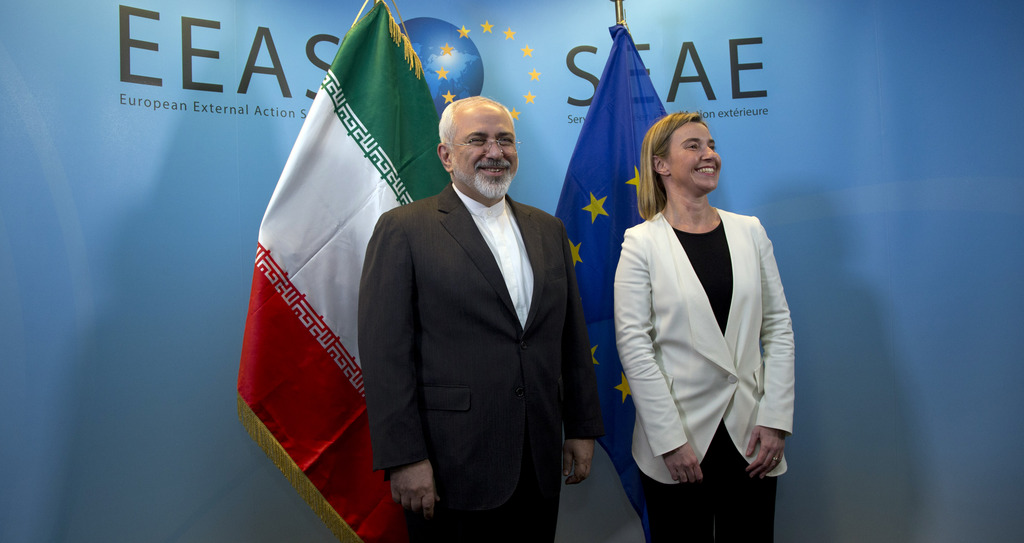 European Union High Representative Federica Mogherini, right, greets Iran's Foreign Minister Mohammad Javad Zarif prior to a meeting in Brussels on Monday, March 16, 2015. European Union foreign ministers hold talks with Iran?s top diplomat on Monday to try to advance an agreement on the Islamic Republic?s nuclear program two weeks ahead of a deadline for an accord to be reached. (AP Photo/Virginia Mayo)