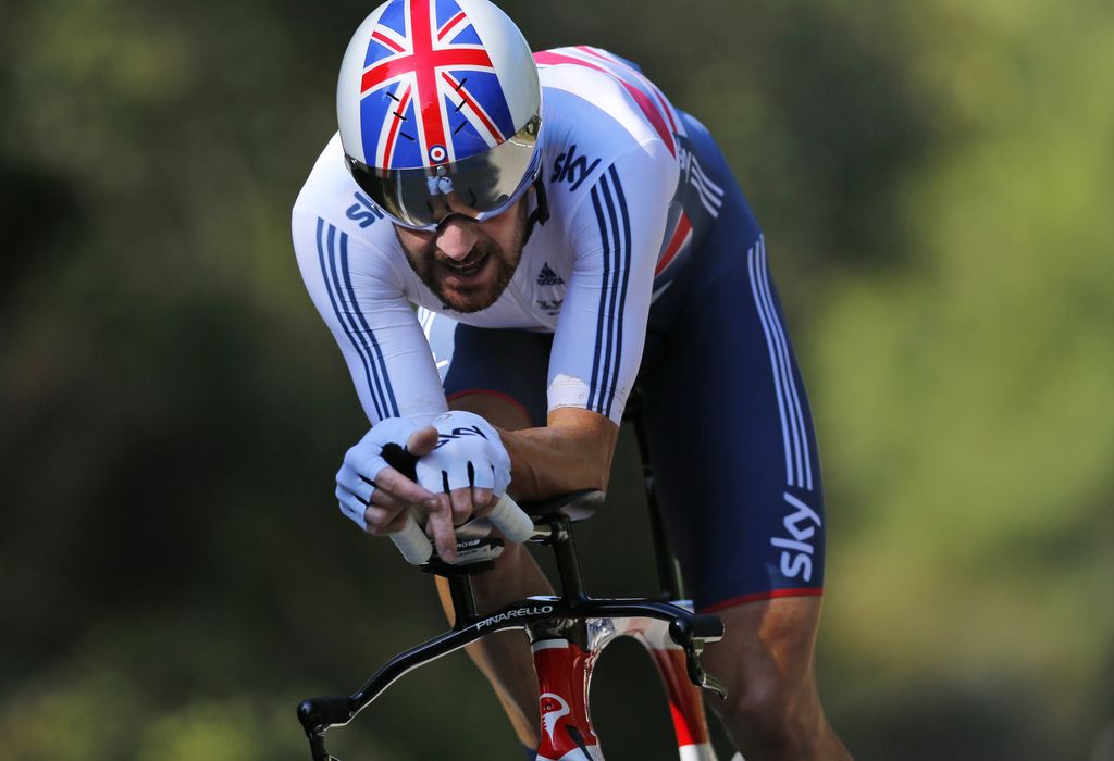 FILE - In this file photo dated Wednesday Sept. 24, 2014, world champion Britain's Bradley Wiggins competes to win the men's individual time trial event at the Road Cycling World Championships in Ponferrada, north-western Spain.  Wiggins is leaving the Sky team that turned him into a Tour de France champion, and during a press conference Friday April 10, 2015, he wasn?t feeling chatty at all and abruptly announced that he wouldn?t be speaking after all.  (AP Photo/Daniel Ochoa de Olza, FILE)