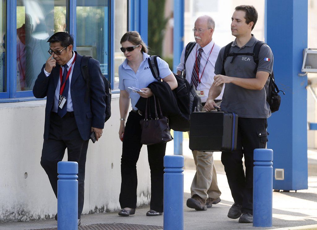 epa04873139 Azharuddin Abdul Rahman (L), director general of Malaysia's Department Civil Aviation, and investigators leave the Directorate General of Armaments (DGA) Aeronautical Technical Center in Balma, near Toulouse, France, 05 August 2015. Aviation experts in southern France started examining an airplane wing part that washed ashore on Reunion Island to determine if it is from Malaysia Airlines flight MH370, which went missing more than a year ago.  If the investigators find it to be from MH370, it would be the first confirmed trace of the Boeing 777 airliner since it disappeared on its way to Beijing on March 8, 2014 with 239 people on board about an hour after it took off from Kuala Lumpur International Airport.  EPA/GUILLAUME HORCAJUELO