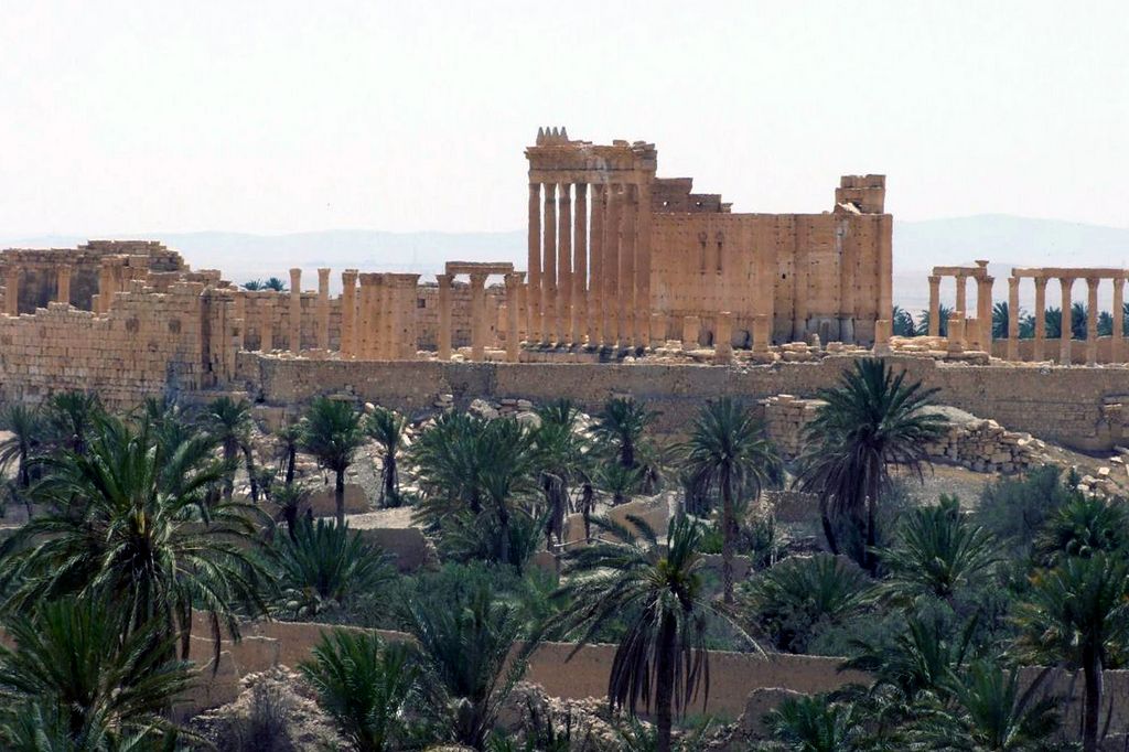 FILE - This file photo released on Sunday, May 17, 2015, by the Syrian official news agency SANA, shows the general view of the ancient Roman city of Palmyra, northeast of Damascus, Syria. Islamic State militants beheaded 81-year-old Khaled al-Asaad, a leading Syrian antiquities scholar who spent most of his life looking after the ancient ruins of Palmyra, then hung his body from a pole in a main square of the historic town, Syrian activists and the scholar's relatives said Wednesday, Aug. 19, 2015. (SANA via AP, File)