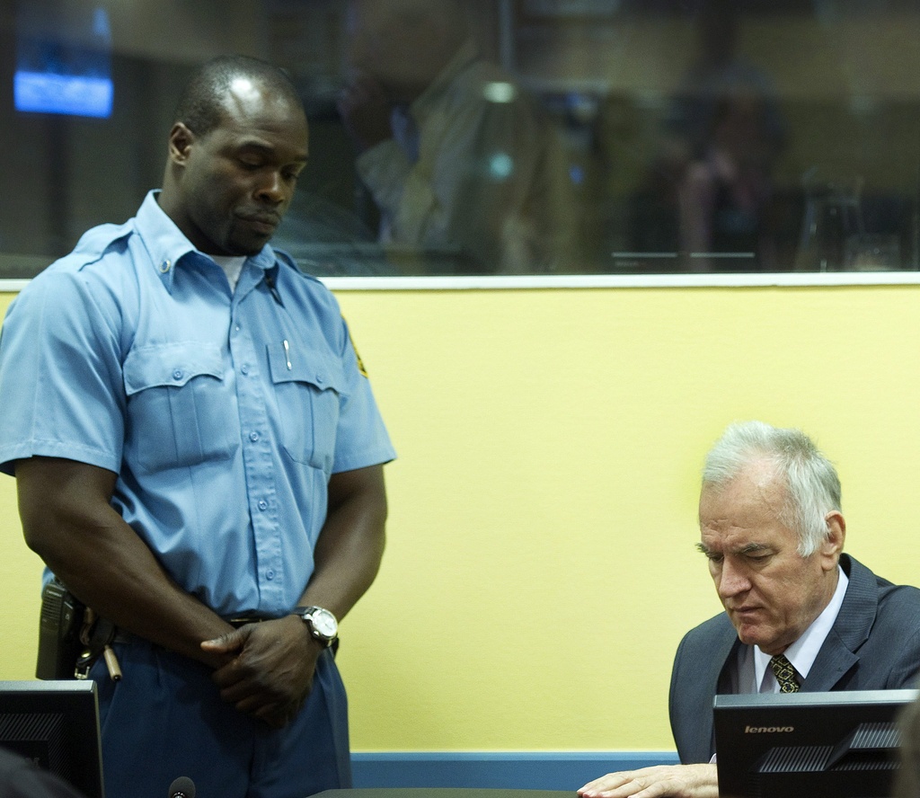 epa03220777 Former Bosnian Serb general  Ratko Mladic (R) sits in the courtroom during his trial at the International Criminal Tribunal for the former Yugoslavia (ICTY) in The Hague, the Netherlands, 16 May 2012. Mladic has been charged with 11 counts of genocide and other war crimes committed by the Serb army he commanded during the 1992-95 Bosnian war against Muslims and ethnic Croats. The most notable of the atrocities was the 1995 Srebrenica massacre of nearly 8,0000 Muslims and the 40-month siege of Sarajevo, in which more than 11,000 people were killed.  EPA/TOUSSAINT KLUITERS / POOL