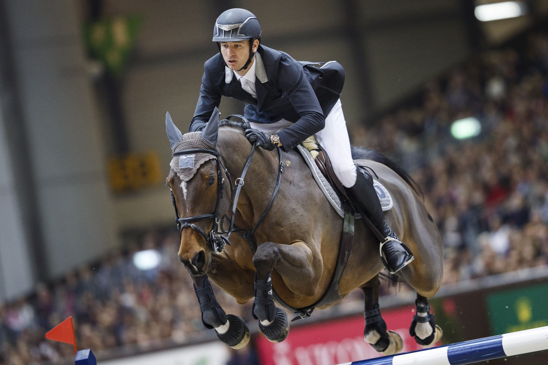 Steve Guerdat from Switzerland rides his horse Nino des Buissonnets to win the first place of the Rolex Grand Prix of show jumping at the 55th CHI international horse show jumping tournament in Geneva, Switzerland, on Sunday, December 13, 2015. (KEYSTONE/Valentin Flauraud)