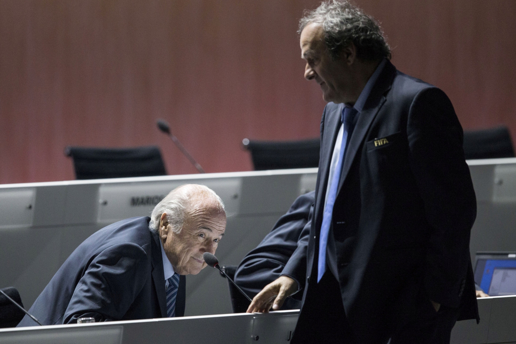 FILE - In this May 29, 2015 file photo FIFA president Joseph S. Blatter, left, takes a seat after welcoming UEFA president Michel Platini, right, during the 65th FIFA Congress held at the Hallenstadion in Zurich, Switzerland. Sepp Blatter and Michel Platini have been banned for 8 years, the FIFA ethics committee said Monday,  Dec. 21, 2015.  (Patrick B. Kraemer/Keystone)