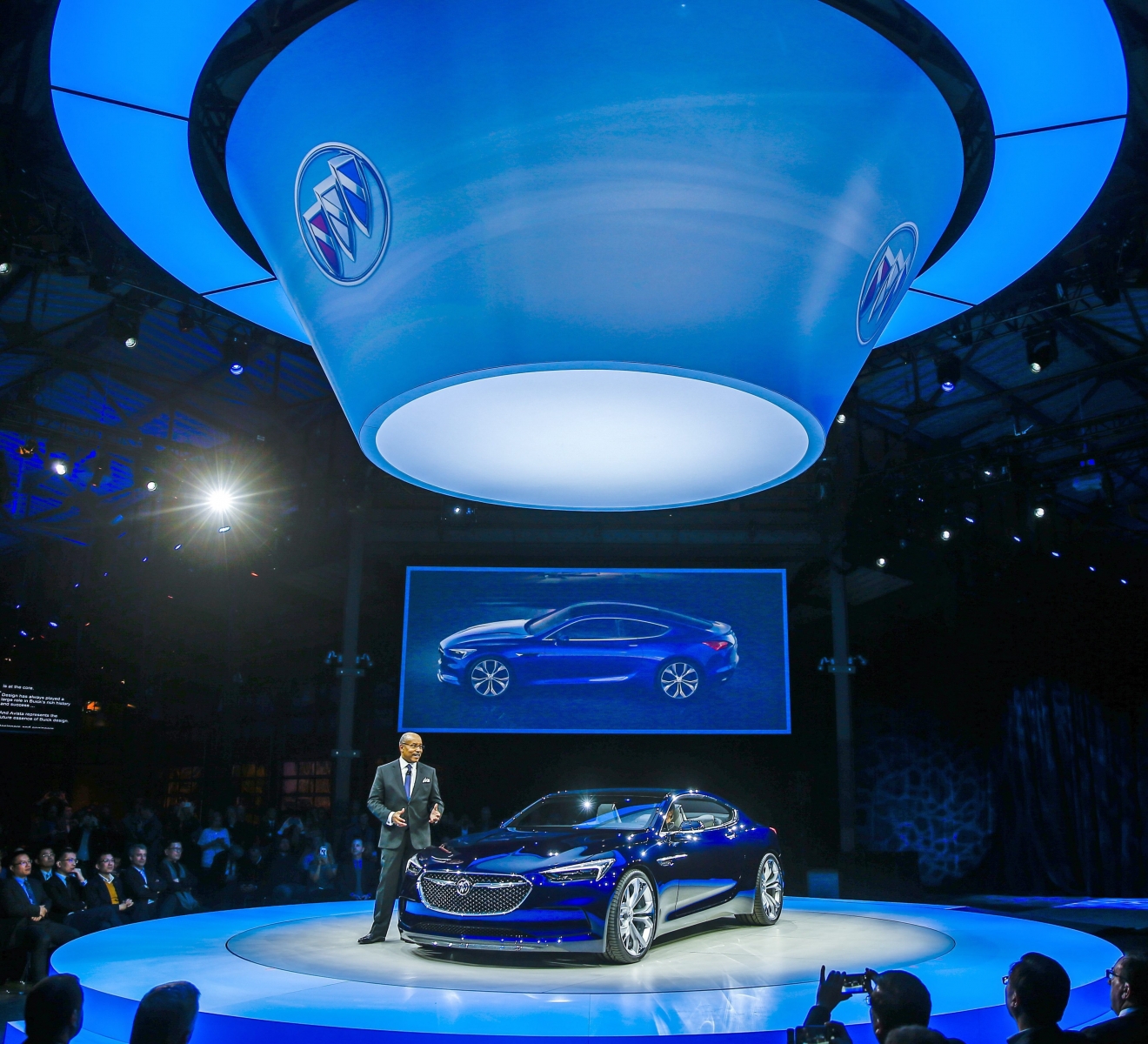 epa05096301 General Motors' Vice President of Global Design, Ed Welburn describes the attributes of the Buick Avista concept automobile during its introduction at a pre-North American International Auto Show event at Shed 3 in Detroit, Michigan, USA, 10 January 2016. The Detroit Auto Show media preview begins on 11 January.  EPA/TANNEN MAURY USA DETROIT AUTO SHOW