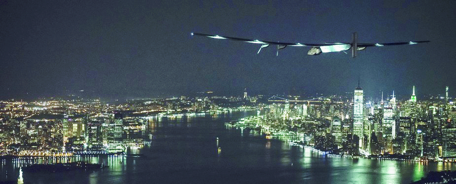 epa05356603 A handout picture made available on 11 June 2016 by the Solar Impulse shows the Solar Impulse 2 (Si2) flying towards the Statue of Liberty before landing in New York, New York, USA, 11 June 2016. Solar Impulse 2 took off from Lehigh Valley to New Yorkline so with Swiss adventurer Andre Borschberg at the controls. Departed from Abu Dhabi on 09 March 2015, the Round-the-World Solar Flight will take 500 flight hours and cover 35,000 kilometers.  EPA/JEAN REVILLARD/REZO/SOLAR IMPULSE  HANDOUT EDITORIAL USE ONLY/NO SALES USA TECHNOLOGY SOLAR IMPULSE