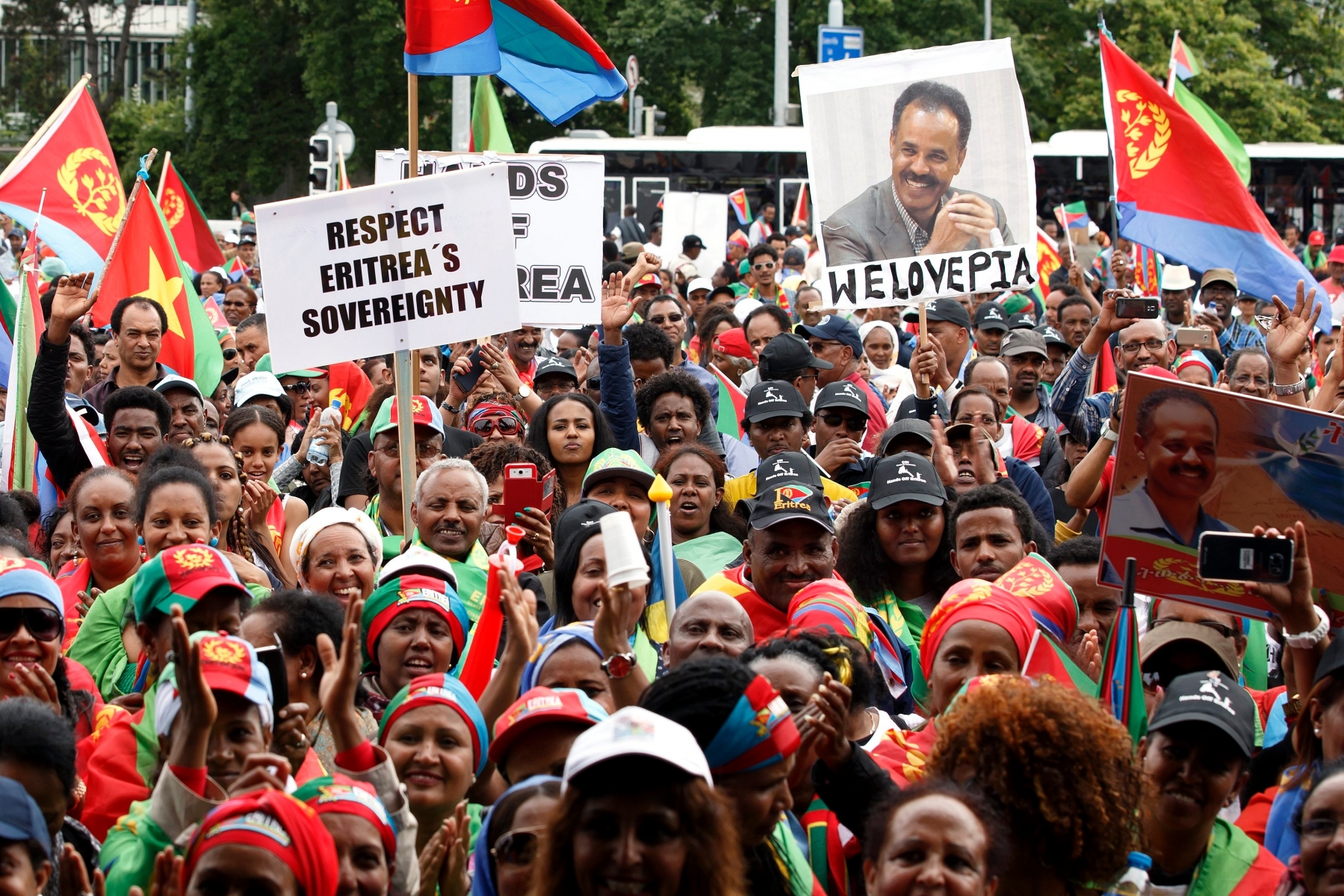 Supporters Eritrea's government protest against the U.N., during a rally on the Place des Nations, in front of the European headquarters of the United Nations in Geneva, Switzerland, Tuesday, June 21, 2016. "Stop" to want "regime change" in Eritrea. Several thousand citizens of this country protested Tuesday at the Place des Nations against the UN and the conclusions of the Commission on Eritrea. (KEYSTONE/Salvatore Di Nolfi) SWITZERLAND ERITREA DEMONSTRATION
