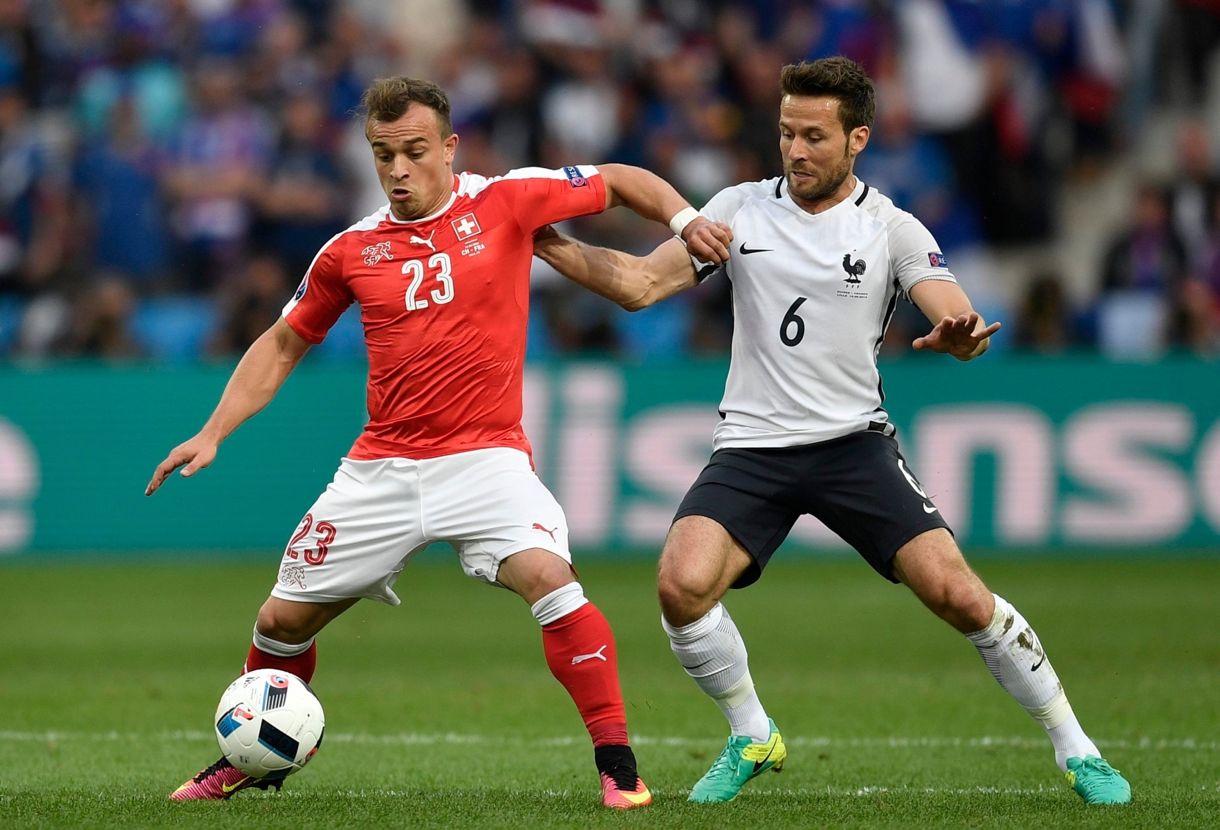 Switzerland's Xherdan Shaqiri, left, fights for the ball with France's Yohan Cabaye during the Euro 2016 Group A soccer match between Switzerland and France at the Pierre Mauroy stadium in Villeneuve díAscq, near Lille, France, Sunday, June 19, 2016. (AP Photo/Martin Meissner) Soccer Euro 2016 Switzerland France