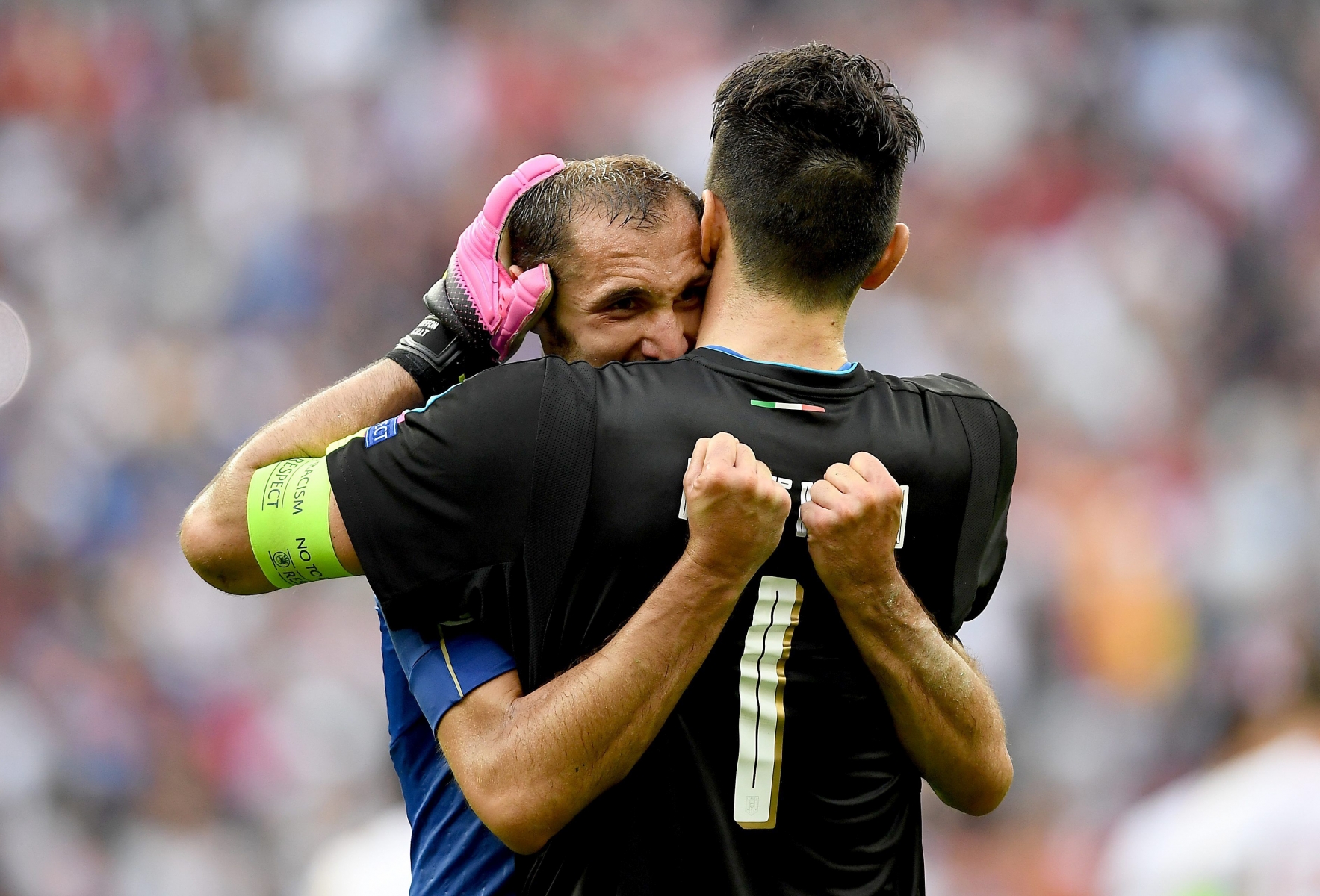 epa05394955 Goalkeeper Gianluigi Buffon of Italy (R) and Giorgio Chiellini of Italy react after the UEFA EURO 2016 round of 16 match between Italy and Spain at Stade de France in St. Denis, France, 27 June 2016. ....(RESTRICTIONS APPLY: For editorial news reporting purposes only. Not used for commercial or marketing purposes without prior written approval of UEFA. Images must appear as still images and must not emulate match action video footage. Photographs published in online publications (whether via the Internet or otherwise) shall have an interval of at least 20 seconds between the posting.)  EPA/GEORGI LICOVSKI   EDITORIAL USE ONLY