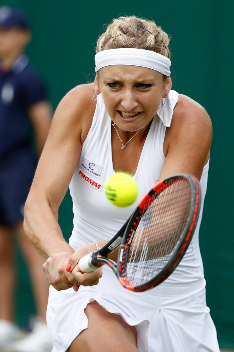 Timea Bacsinszky of Switzerland in action during her first round match against Luksika Kumkhum of Thailand, at the All England Lawn Tennis Championships in Wimbledon, London, Thursday, June 30, 2016. (KEYSTONE/Peter Klaunzer) BRITAIN TENNIS WIMBLEDON 2016