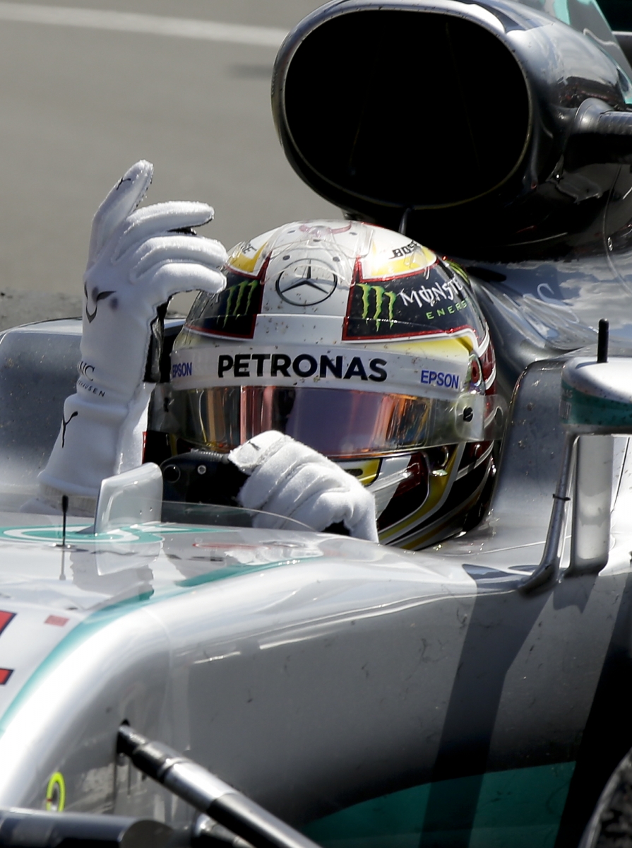 Mercedes driver Lewis Hamilton of Britain celebrates after winning the British Formula One Grand Prix at the Silverstone racetrack, Silverstone, England, Sunday, July 10, 2016. (AP Photo/Luca Bruno)