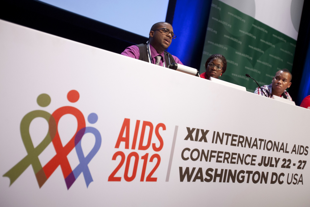 Lawrence Stallworth II, 20, of Cleveland, Ohio, left, who was diagnosed with HIV at age 17, speaks on a youth panel at the International AIDS Conference, next to Helena Nangombe, of Namibia, and Romane Knight, of Jamaica, in Washington, on Sunday, July 22, 2012. (AP Photo/Jacquelyn Martin)