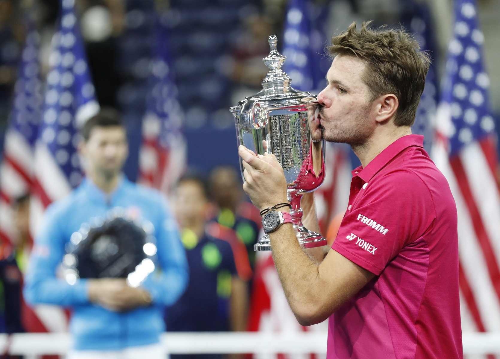 epa05535778 Stan Wawrinka of Switzerland (R) during the trophy ceremony after defeating Novak Djokovic of Serbia (L) during the men's final on the final day of the US Open Tennis Championships at the USTA National Tennis Center in Flushing Meadows, New York, USA, 11 September 2016.  The US Open runs through September 11.  EPA/JUSTIN LANE