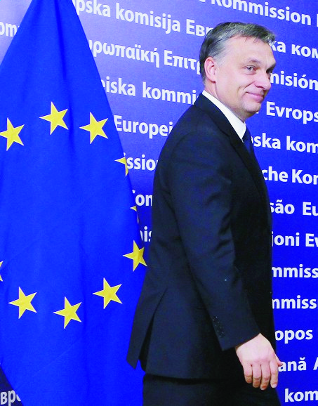 epa03076236 Hungarian Prime Minister Viktor Orban arrives for a meeting with European Commission president Jose Manuel Barroso at the European Commission headquarter in Brussels, Belgium, 24 January 2012. Orban insisted on 24 January that he is ready to work with the European Union on the concerns it has about his country. 'I am absolutely ready to discuss all the issues - regardless how difficult these issues are - in an open manner and draw conclusions, if it is possible to draw conclusions together, and to find agreement,' he told reporters during a visit to Brussels. His meetings with EU President Herman Van Rompuy, European Commission President Jose Manuel Barroso and European Parliament President Martin Schulz come one week after the commission initiated legal action against Budapest over recent constitutional reforms.  EPA/JULIEN WARNAND BELGIUM EU COMMISSION BARROSO ORBAN