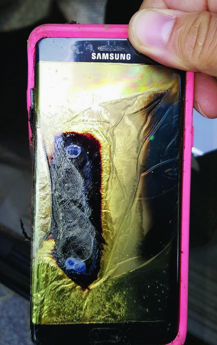 This Friday, Oct. 7, 2016, photo provided by Andrew Zuis, of Farmington, Minn., shows the replacement Samsung Galaxy Note 7 phone belonging to his 13-year-old daughter Abby, that melted in her hand earlier in the day. "She's done with Note 7s right now," Zuis said of his daughter. Reports of more replacement phones catching fire are trickling in, and the South Korean tech giant faces more scrutiny after earlier criticism for being slow to react and sending confusing signals in the first days of the recall. (Andrew Zuis via AP) TEC-Samsung Troubles