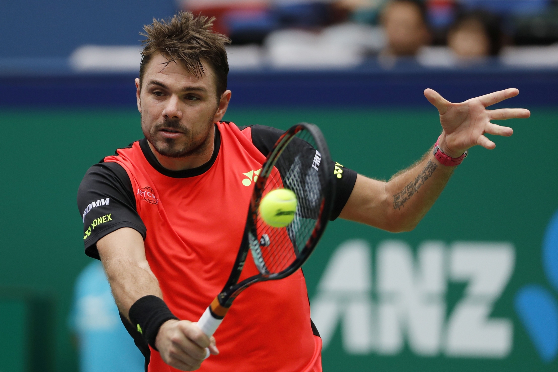 Stan Wawrinka of Switzerland hits a return shot against Kyle Edmund of Britain during the men's singles match of the Shanghai Masters tennis tournament at Qizhong Forest Sports City Tennis Center in Shanghai, China, Wednesday, Oct. 12, 2016. (AP Photo/Andy Wong)
