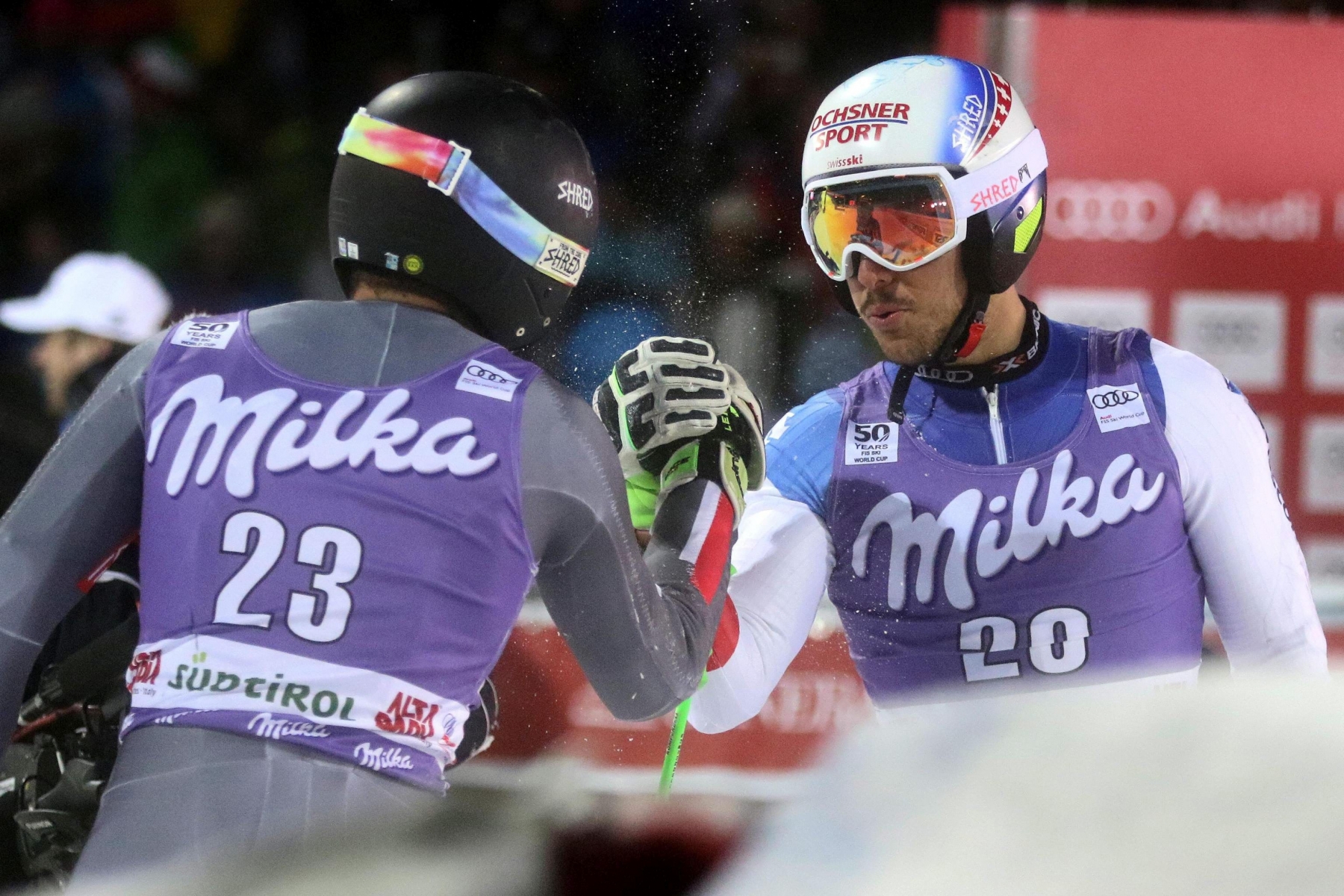 epa05682680 Cyprien Sarrazin, left, of France celebrates with Carlo Janka of Switzerland in the finish area after the Men's Parallel Giant Slalom race at the FIS Alpine Skiing World Cup event in Alta Badia, Italy, 19 December 2016. Sarrazin won ahead second placed Carlo Janka of Switzerland, and third placed Kjetil Jansrud of Norway.  EPA/ANDREA SOLERO