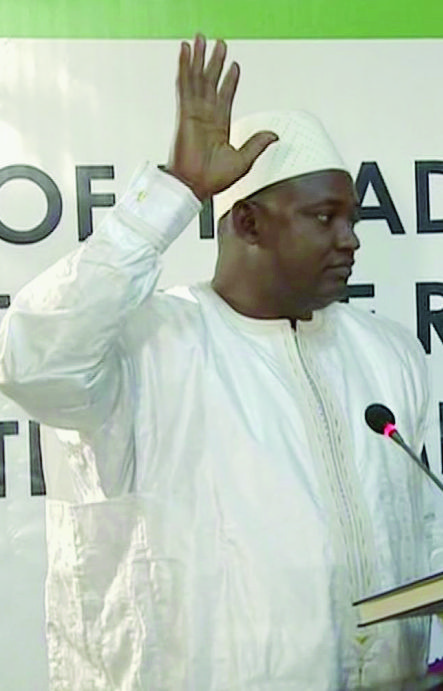 Adama Barrow is sworn in as President of Gambia at Gambia's embassy in Dakar Senegal in this image taken from TV  Thursday, Jan 19, 2017.  A new Gambian president has been sworn into office in neighboring Senegal, while Gambia's defeated longtime ruler refuses to step down from power, deepening a political crisis in the tiny West African country.
(RTS via AP) Gambia Crisis