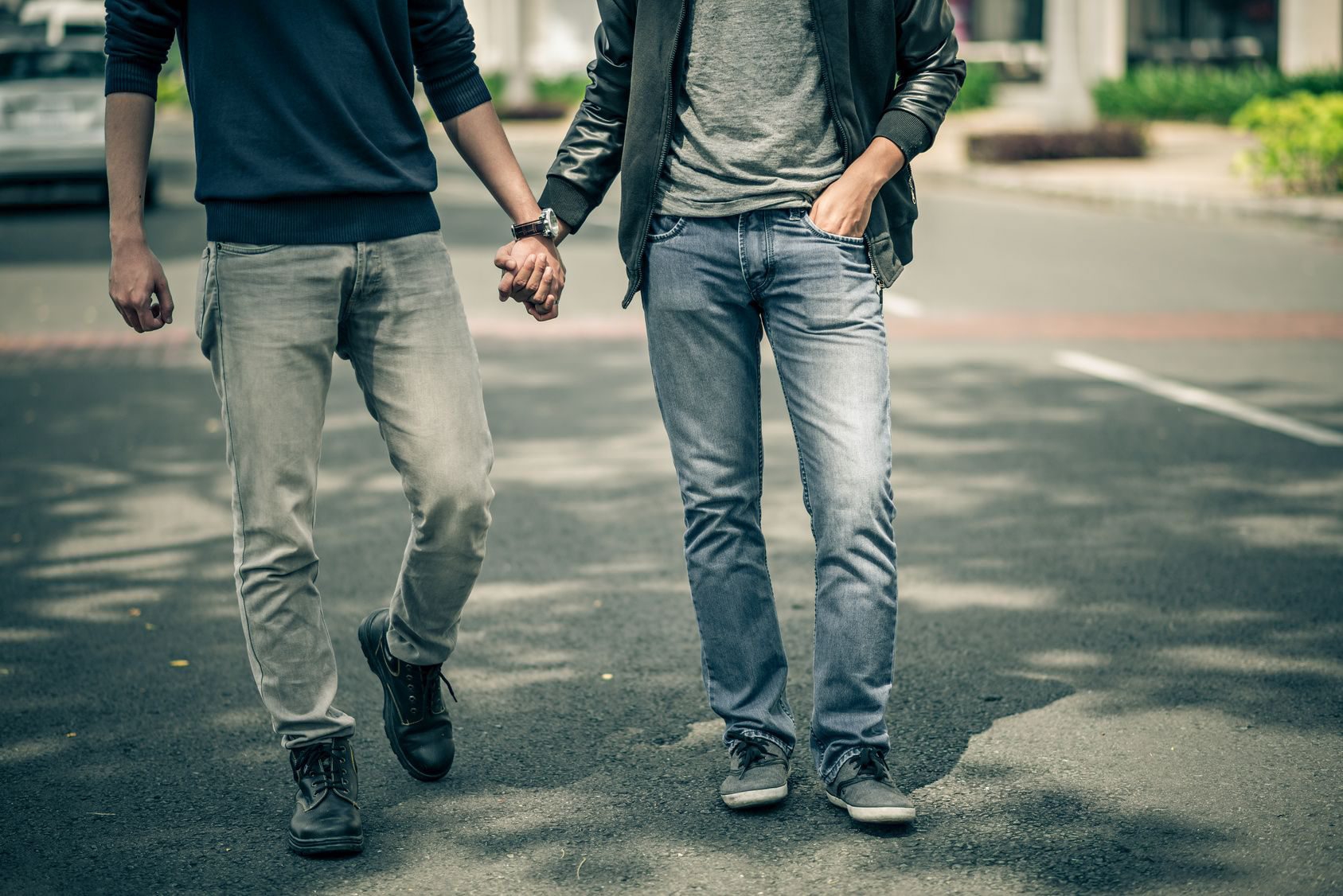 Cropped image of gay couple holding hands Gay couple