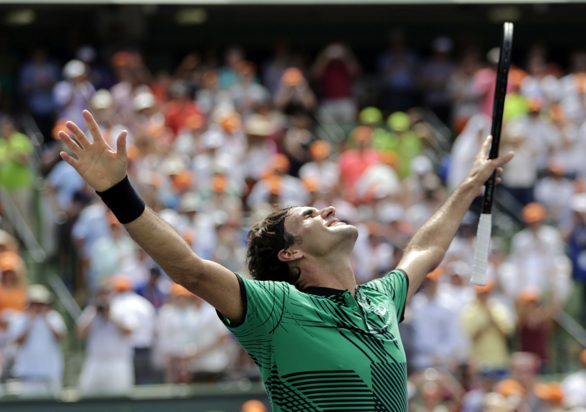 Roger Federer, of Switzerland, celebrates after defeating Rafael Nadal, of Spain, in the men's singles final at the Miami Open tennis tournament, Sunday, April 2, 2017, in Key Biscayne, Fla. (AP Photo/Lynne Sladky)