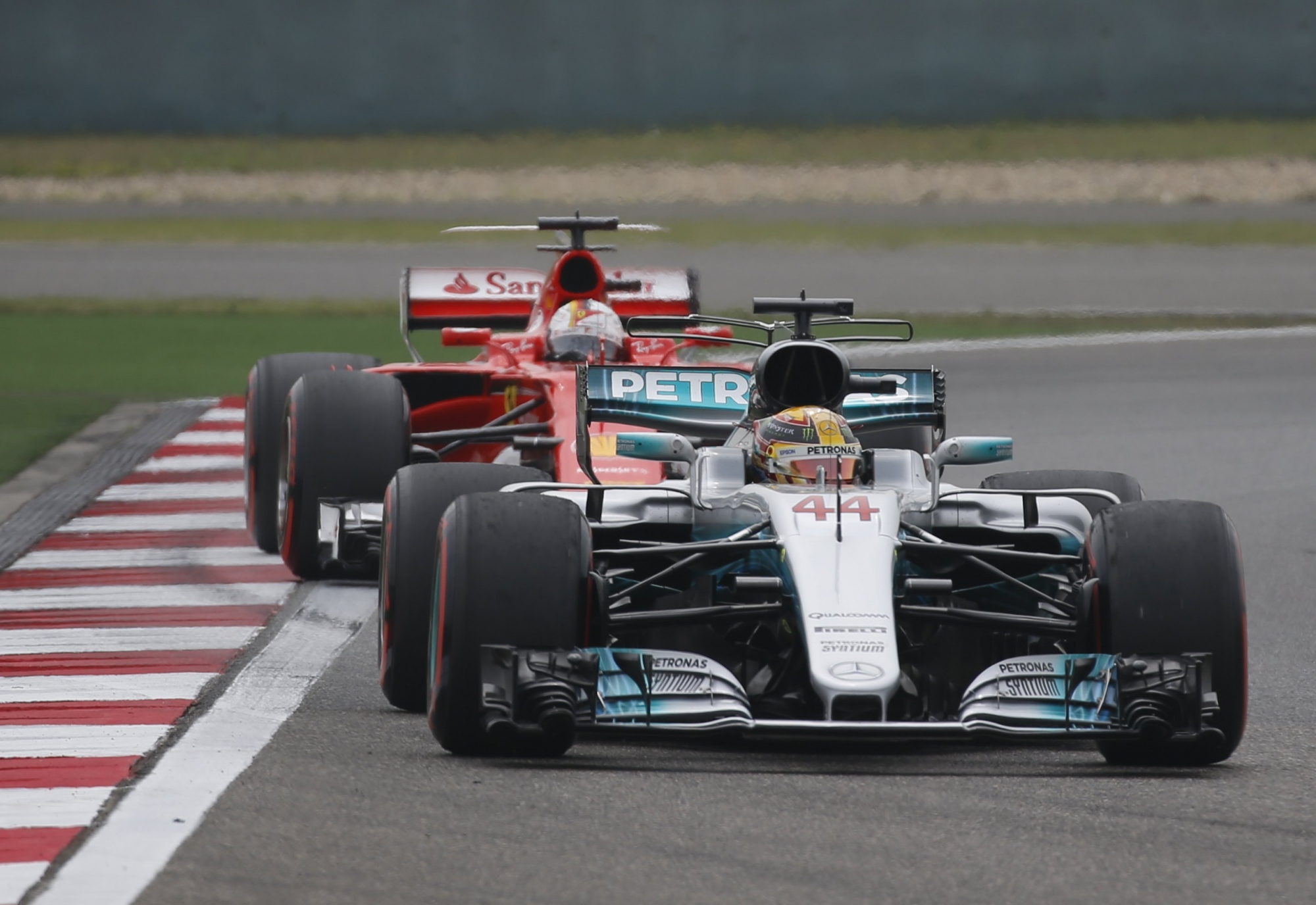 epa05896291 British Formula One driver Lewis Hamilton (front) of Mercedes AMG GP is followed by German Formula One driver Sebastian Vettel (rear) of Scuderia Ferrari during the third practice session at Shanghai international circuit in Shanghai, China, 08 April 2017. The 2017 Chinese Formula One Grand Prix will take place on 09 April.  EPA/LYNN BO BO