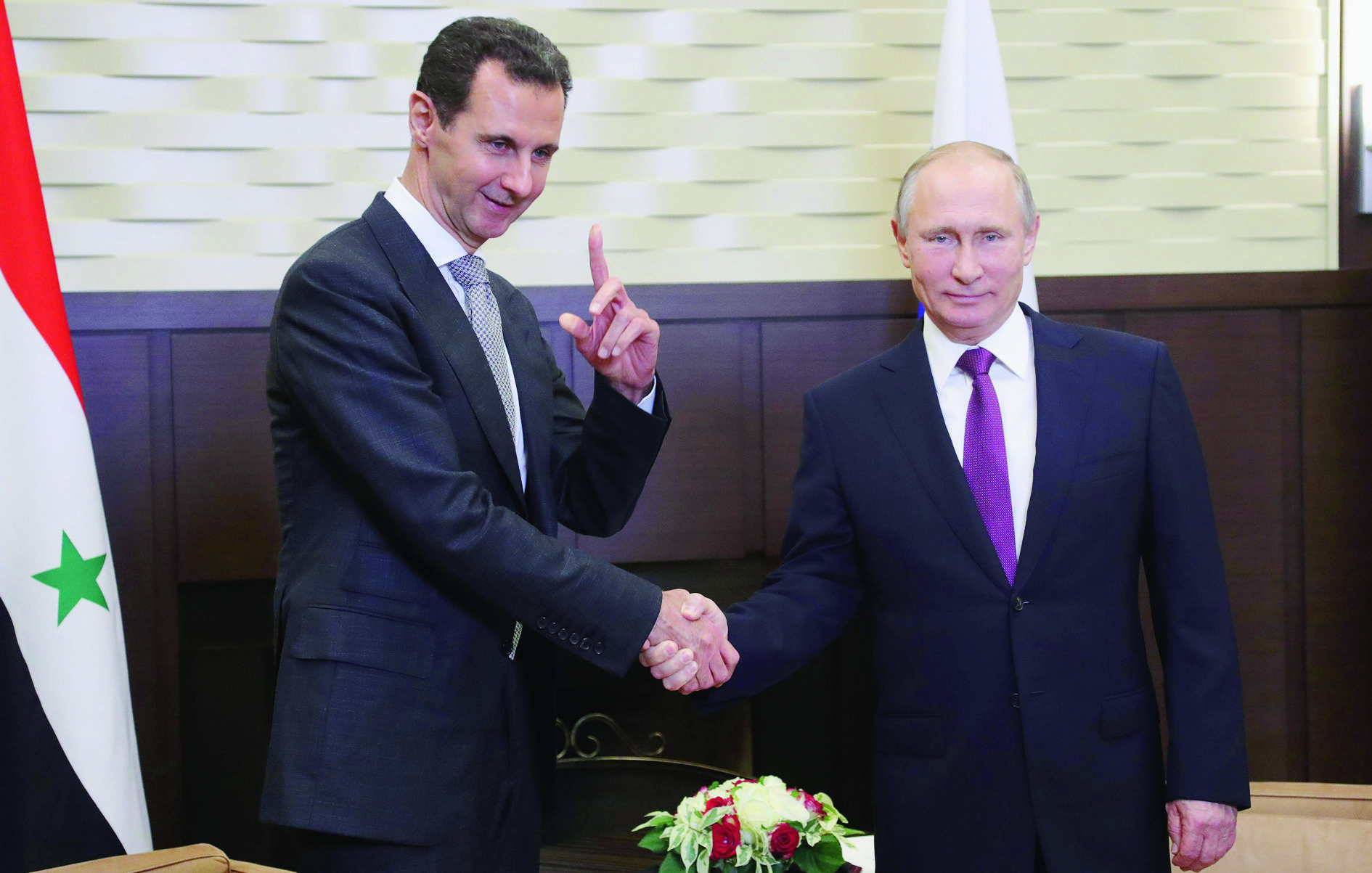 epa06341403 Russian President Vladimir Putin (R) shakes hands with Syrian President Bashar al-Assad (L) during their meeting in the Black sea resort of Sochi, Russia, 20 November 2017 (issued 21 November 2017). According to reports the two leaders met over talks focusing on the Syrian conflict.  EPA/MICHAEL KLIMENTYEV/SPUTNIK/KREMLIN / POOL MANDATORY CREDIT RUSSIA SYRIA DIPLOMACY