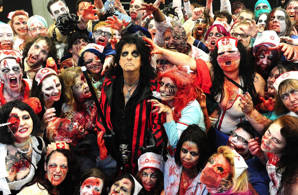 Alice Cooper poses with zombies backstage  at his Halloween Night Of Fear lll concert at Wembley Arena in London, Sunday Oct. 28, 2012. (AP Photo / Ian West/PA)UNITED KINGDOM OUT NO SALES NO ARCHIVE