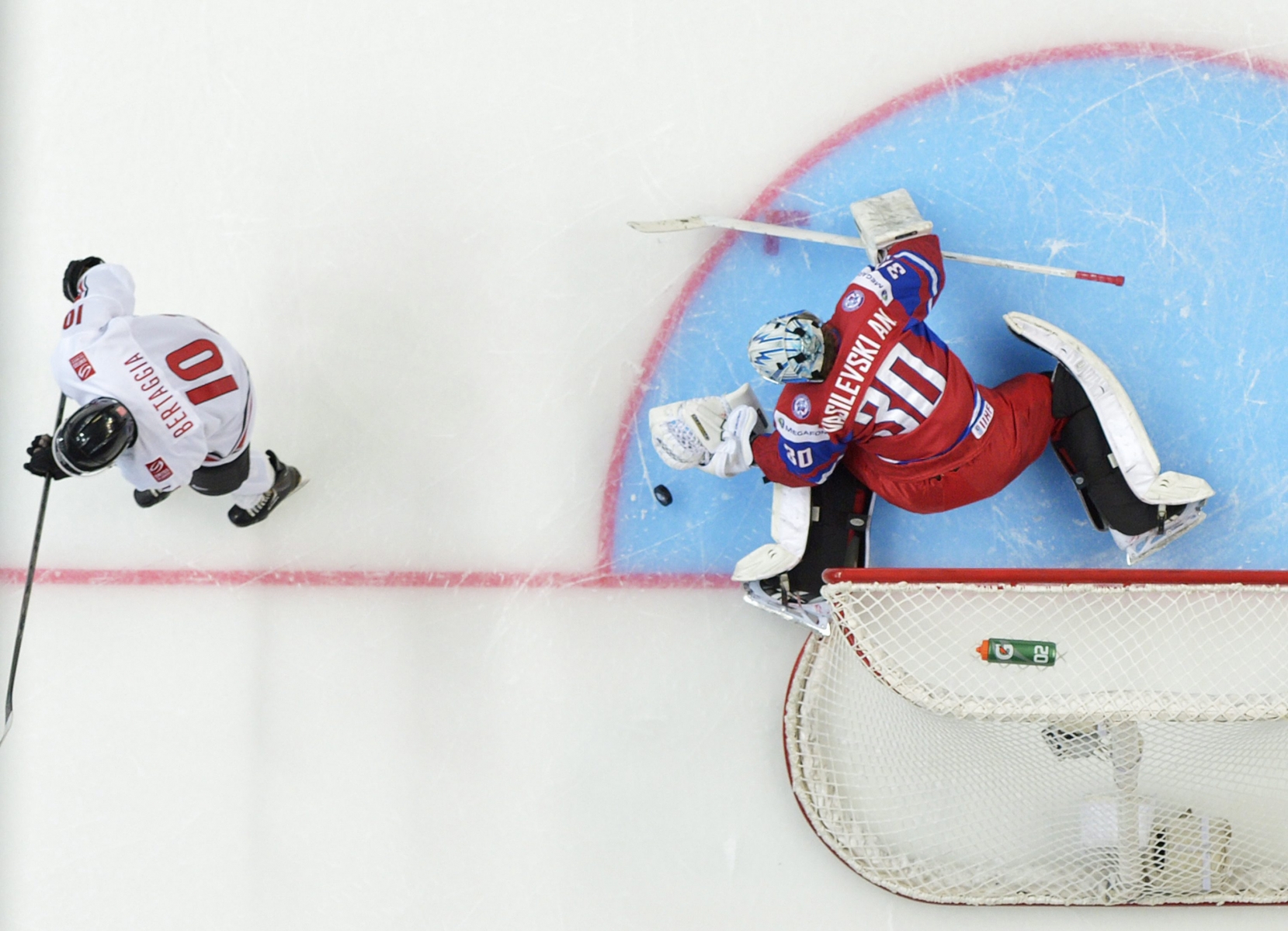 Russia goalie Andrei Vasilevski (30) makes the final shootout stop by Switzerland forward Alessio Bertaggia (10) in a quarterfinal match at the world junior hockey championships in Ufa, Russia, Wednesday, Jan. 2, 2013. Russia defeated Switzerland 4-3. (AP Photo/The Canadian Press, Nathan Denette) 