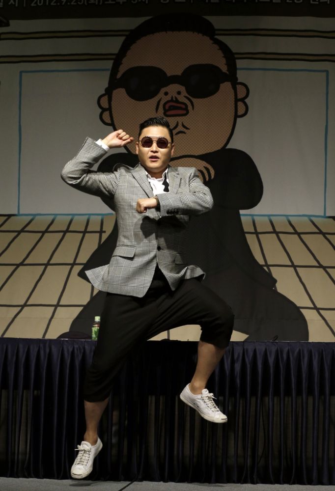 South Korean rapper PSY, who sings the popular "Gangnam Style" song, dances after his press conference in Seoul, South Korea, Tuesday, Sept. 25, 2012. (AP Photo/Lee Jin-man)