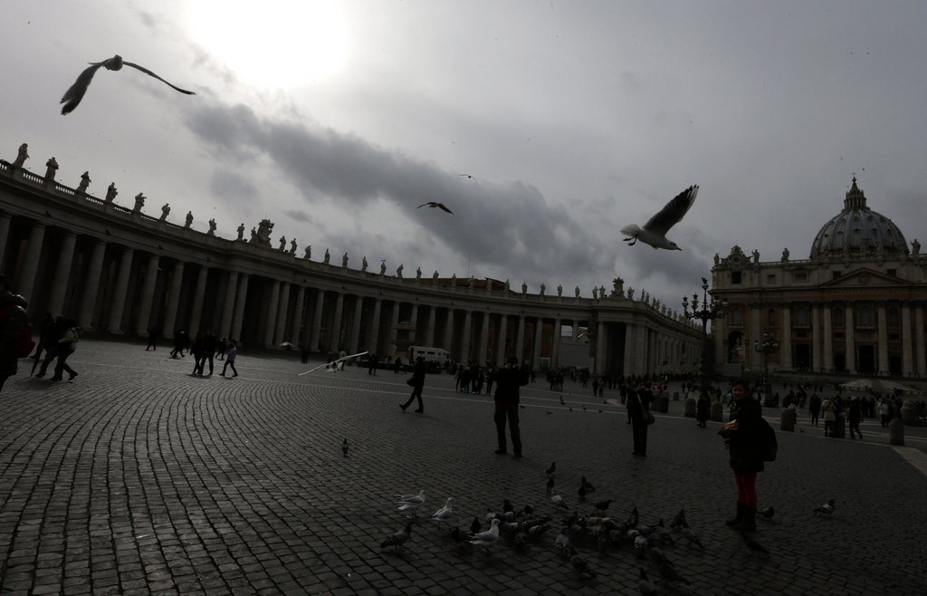 Birds fly across the sky as St. Peter's Basilica is seen in the background, at the Vatican, Monday, Feb. 11, 2013. Pope Benedict XVI said Monday he lacks the strength to fulfill his duties and on Feb. 28 will become the first pontiff in 600 years to resign. The announcement sets the stage for a conclave in March to elect a new leader for world's 1 billion Catholics.  (AP Photo/Alessandra Tarantino)